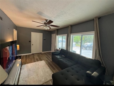 Living room featuring dark hardwood / wood-style f