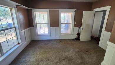 Doorway featuring carpet floors