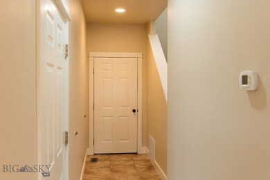 hallway off the kitchen with the garage on the lef