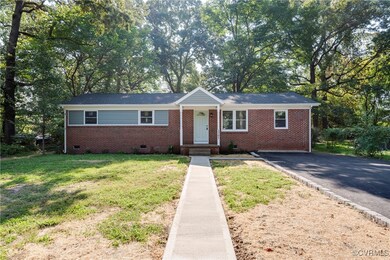 Ranch-style house with a front lawn