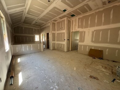 Open great room and dining area - still under cons