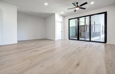 Unfurnished room featuring a ceiling fan, light w