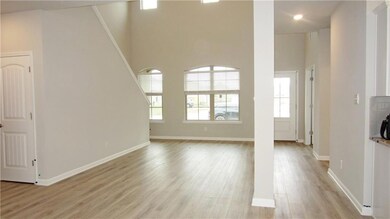 View of Foyer, Dining Area and Living Area.