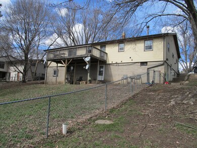 Back of tri plex faces South, Main level unit has a deck