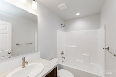 Full bathroom with shower / tub combination and vanity