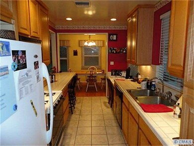 Interior laundry off of kitchen (behind)