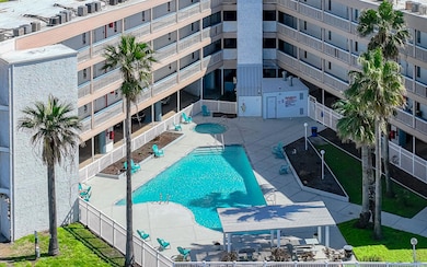 Community pool with a patio