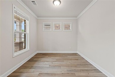 Unfurnished room featuring light wood-style floors