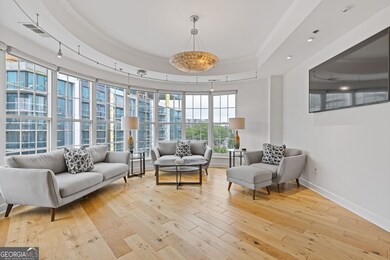 This living space is the perfect city living space.  The wall of windows is the perfect accent to this room.