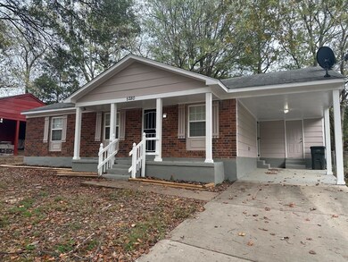 View of front of property with covered porch and a