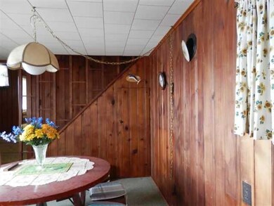 Living Room Knotty pine walls in kitchen eating ar