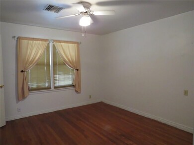 Bedroom with wood floors