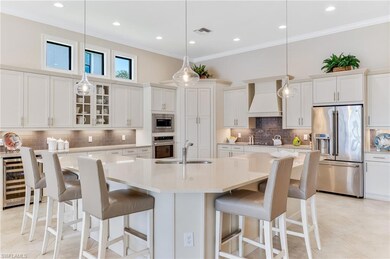 Kitchen to include wine refrigerator, center island