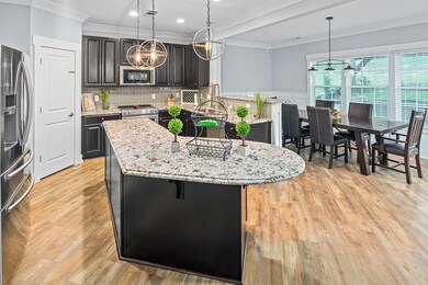Beautiful kitchen with granite, tile backspash and upgraded Kitchen Aid Stainless Steel appliances!
