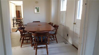 Dining room with door to back porch.