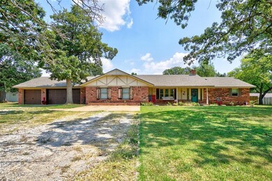 Ranch-style house with a front lawn and a garage