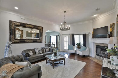 Living room with an inviting chandelier, a tiled f