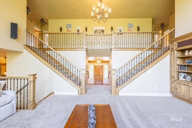 Stairway featuring carpet floors, a chandelier, and a towering ceiling