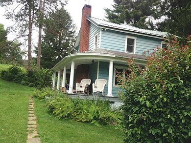 Exterior Front. Newer metal roof on main house!
