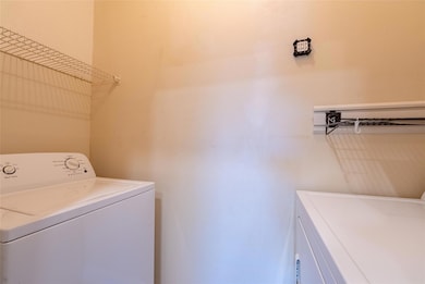 Washroom featuring laundry area and separate wash