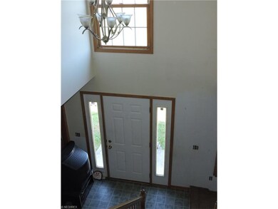 Two story foyer, to the right Living room, to the 