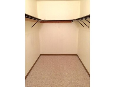 Master Bedroom walk-in closet. (again... off white