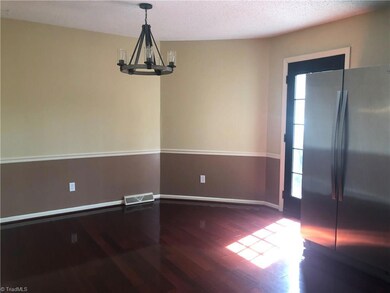 Large eat in Kitchen with door leading to deck.