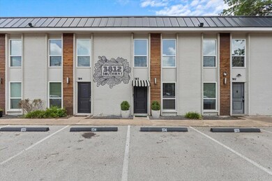 View of building exterior featuring uncovered par