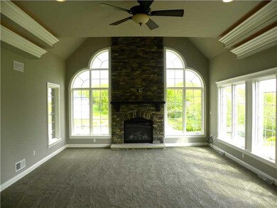 Family Room. Stone floor to ceiling gas fireplace