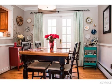 Charming & Cozy Formal Dining Room with French Doo