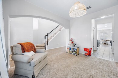Sitting room with tile patterned flooring, arched