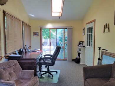 Heated sunroom is now used as an office.