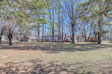 View of yard with a carport