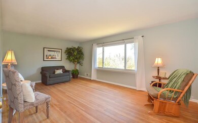 Fantastic Living Room has large picture windows ov