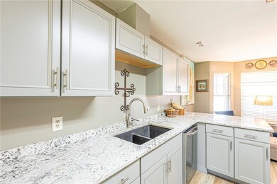 fully renovated with exquisite attention to detail, featuring stunning granite countertops that provide ample space for meal preparation and entertaining.
