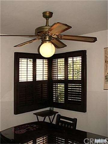 Fan and plantation shutters in the dining room.