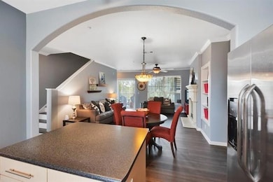 Dining room with crown molding, stairs, ceiling f