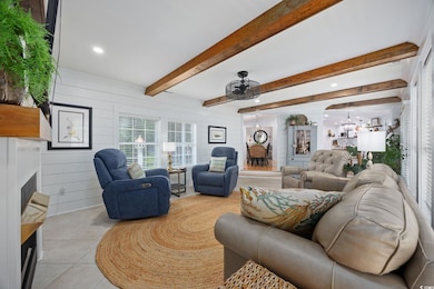 Living area featuring light tile patterned floors,