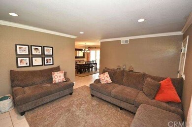 Living room shot that leads into dining room.