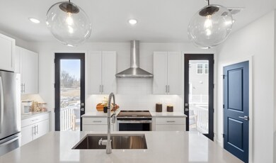 Kitchen with full-height tile backsplash  