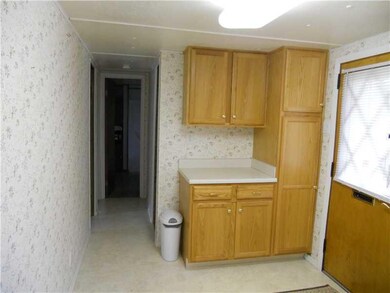 Kitchen. Hallway leading to first floor laundry on