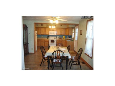 View of dining room and kitchen from office area.