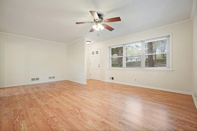 The living room showing the front entrance area.