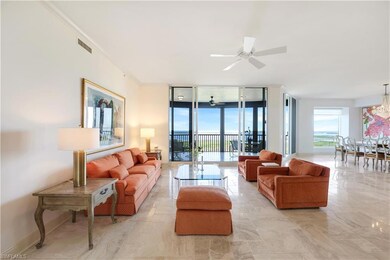 Living room featuring ornamental molding, floor to