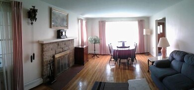 Large living room w/hardwood floors and wood-burni