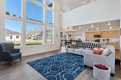 Open concept living space with floor to ceiling windows