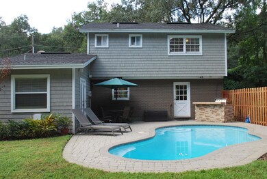 pool has outdoor cooking area