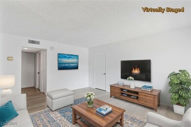 Living area featuring wood finished floors and a t