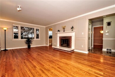 INVITING LIVING RM WITH LARGE PICTURE WINDOWS CROW