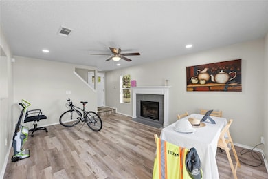 Living room with baseboards, wood finished floors
